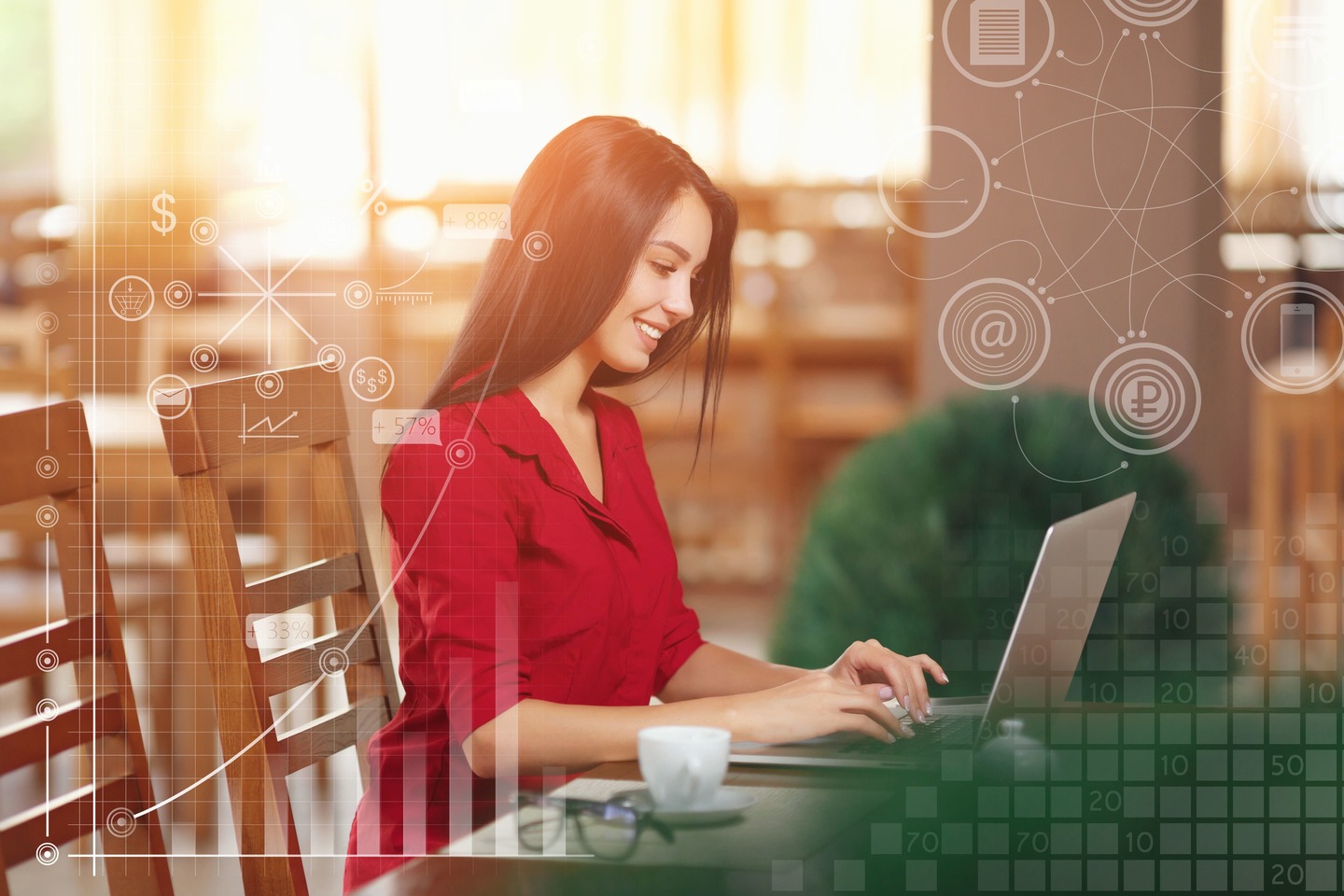 Young business woman uses laptop in cafe